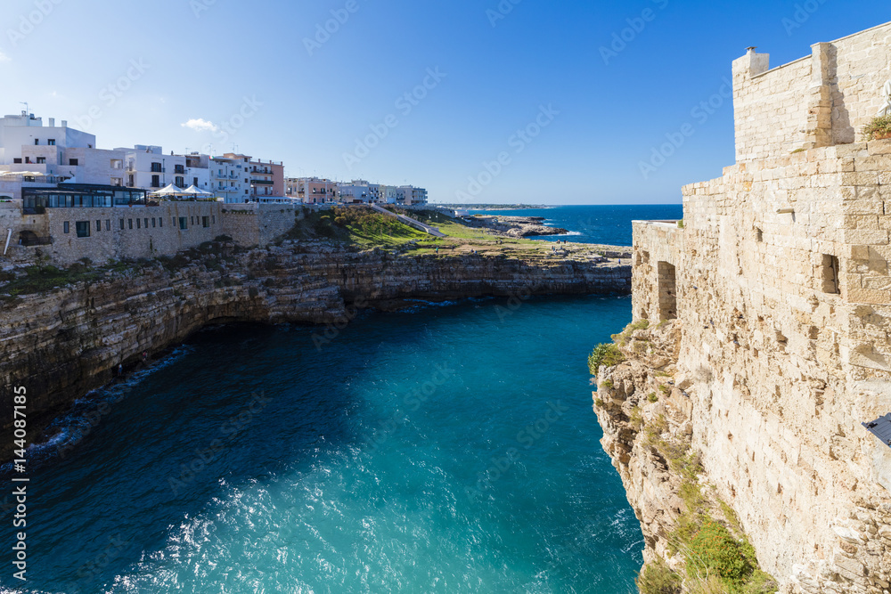 Turquoise sea framed by the old town perched on the rocks, Polignano a Mare, Province of Bari, Apulia Turquoise sea framed by the old town perched on the rocks, Polignano a Mare, Province of Bari, Apulia