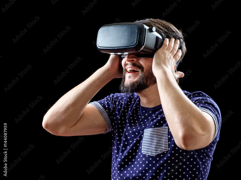 Young happy man experiencing virtual reality Young happy man experiencing virtual reality