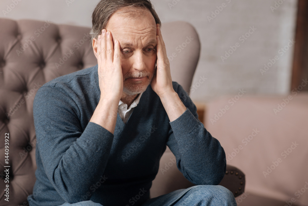 Old handsome man has terrible headache Old handsome man has terrible headache