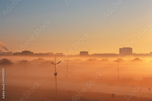 cityscape with fog at dawn