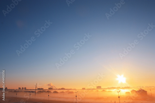 cityscape with fog at dawn
