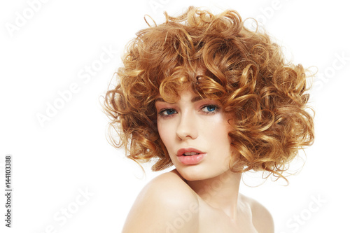 Young beautiful sexy woman with curly hair over white background