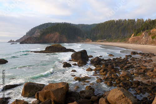 Oregon ocean coast at sunset. View to the Indian Beach in Ecola State Park. USA Pacific Northwest. photo