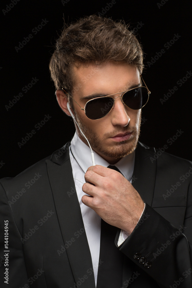 Handsome security guard with headphones Handsome security guard with headphones
