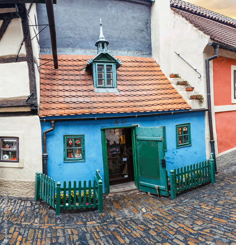 Fairy tale bright colored houses on the famous golden street named Zlata ulicka in Prague's castle photo