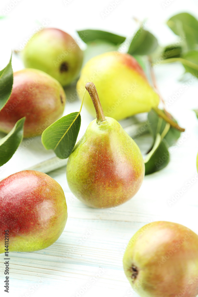Ripe pears on white wooden table Ripe pears on white wooden table