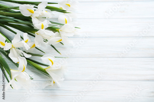 Fototapeta Naklejka Na Ścianę i Meble -  Bouquet of iris flowers on white wooden table