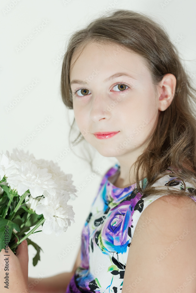 Cute teen girl with bouquet of flowers Cute teen girl with bouquet of flowers