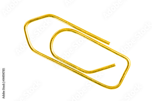 Golden grounge  paper clip isolated on white background close up