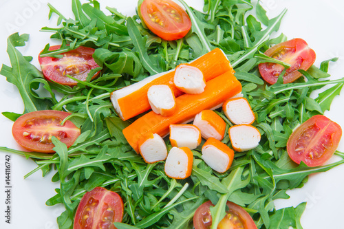 Fotografie surimi with rocket and cherry tomatoes