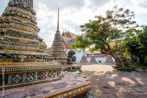 Panorama of Ancient Stupas and pagoda in Wat Pho - famous landmark in Bangkok. Wat Pho is a Buddhist temple complex in Bangkok, traditional outdoor landscape of Thailand. photo