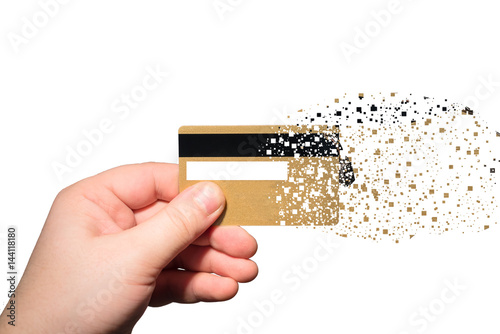 hand holding credit card which is sprayed