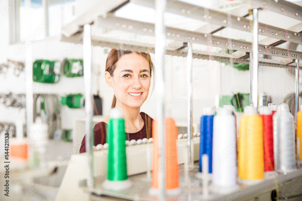 Cute woman in a textile factory Cute woman in a textile factory