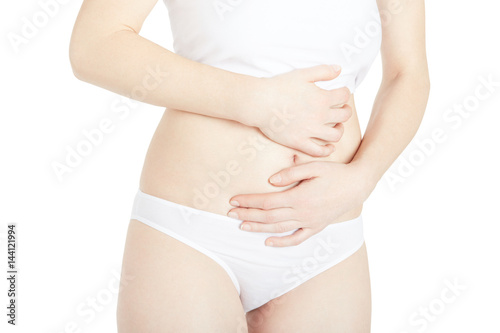 Young woman suffering from abdominal pain isolated on white, clipping path