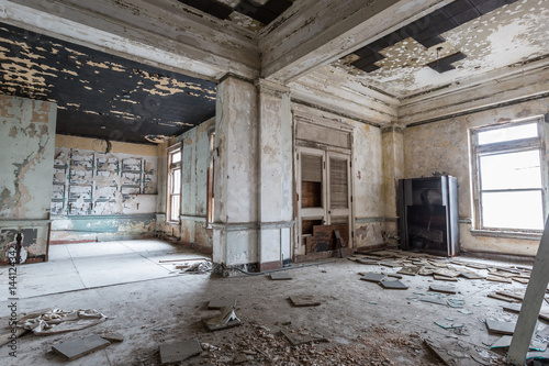 Old abandoned building in decay with broken glass and building materials
