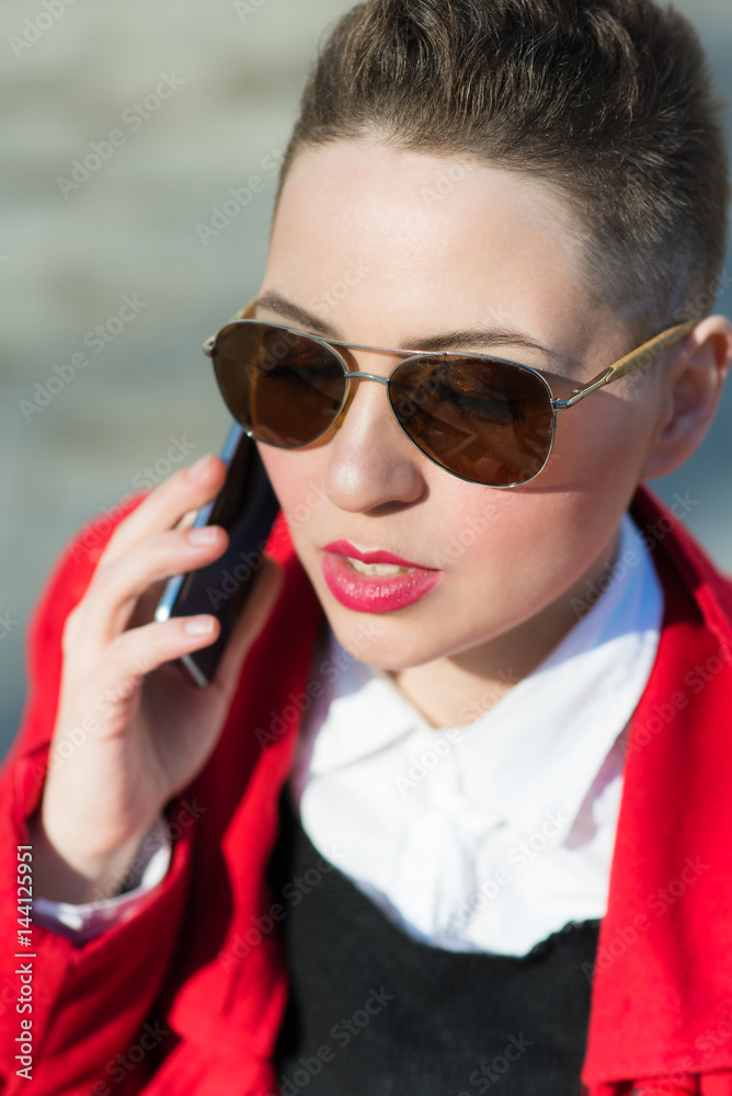 Girl model with phone on blurred background Girl model with phone on blurred background