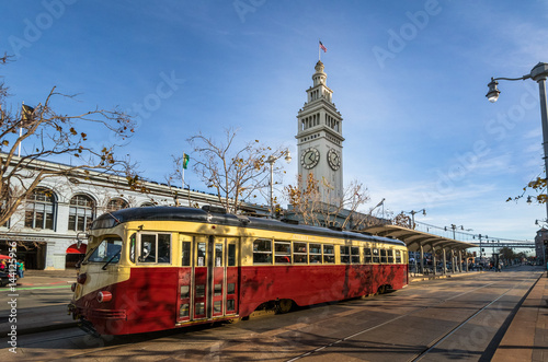 Street car or trollley or muni tram in front of San Francisco Ferry Building in Embarcadero - San Francisco, California, USA