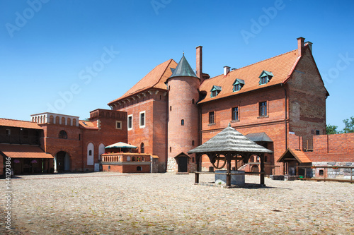 View of 15th century Gothic castle in Tykocin after the reconstruction work. The Castle located on the right bank of Narew river in Tykocin, Podlasie, Poland. photo