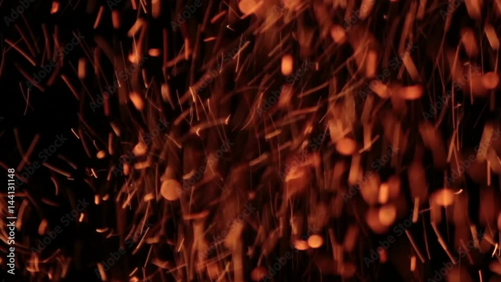 The sparks fly out of fire. Isolated on black background. The sparks fly out of fire. Isolated on black background.