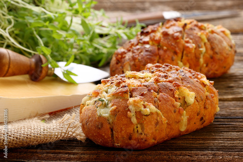 Homemade fresh bread stuffed cheese and garlic with herbs