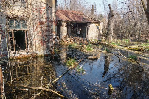 Old destroyed and abandoned house is flooded with water