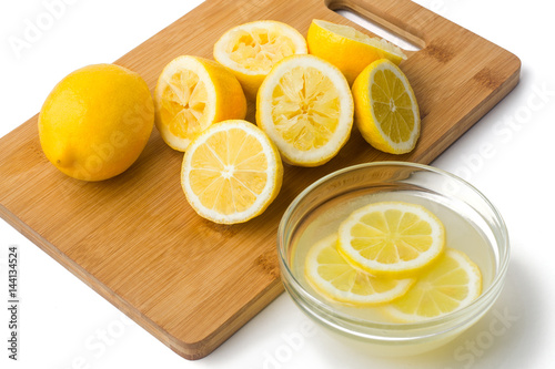 Lemons and juice on white background   © grey