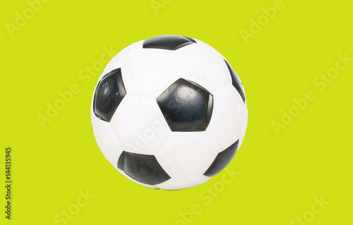 Football soccer ball green background.