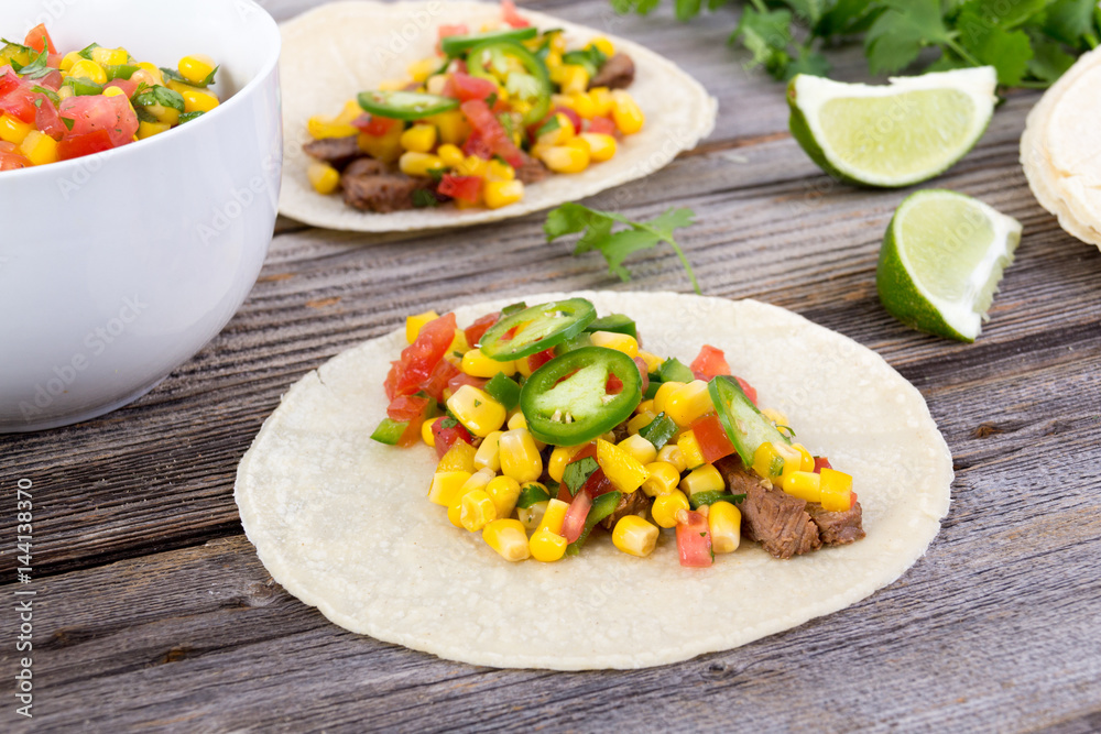 beef corn soft taco on rustic wood table beef corn soft taco on rustic wood table