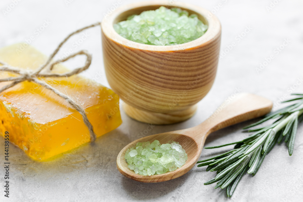 close up body care rosemary cosmetic products on stone background close up body care rosemary cosmetic products on stone background