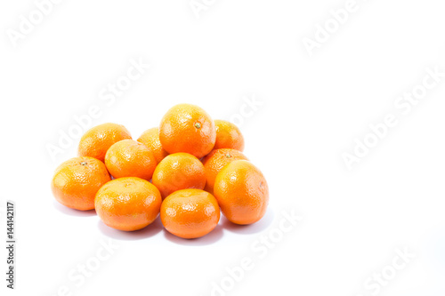Fresh stack of shinning orange clementine isolated in white background