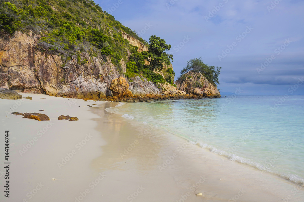 paradise sea landscape with white sand and emerald ocean shore in Rawa Island Malaysia