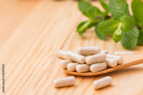 Obraz na płótnie Vitamins supplements in spoon.