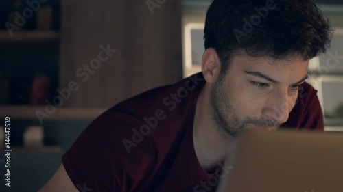 Young businessman using laptop