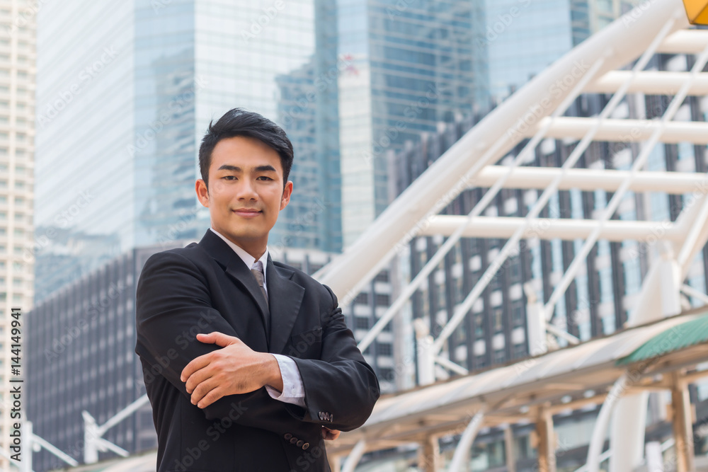 portrait of business man standing with commitment to success in downtown with building background portrait of business man standing with commitment to success in downtown with building background