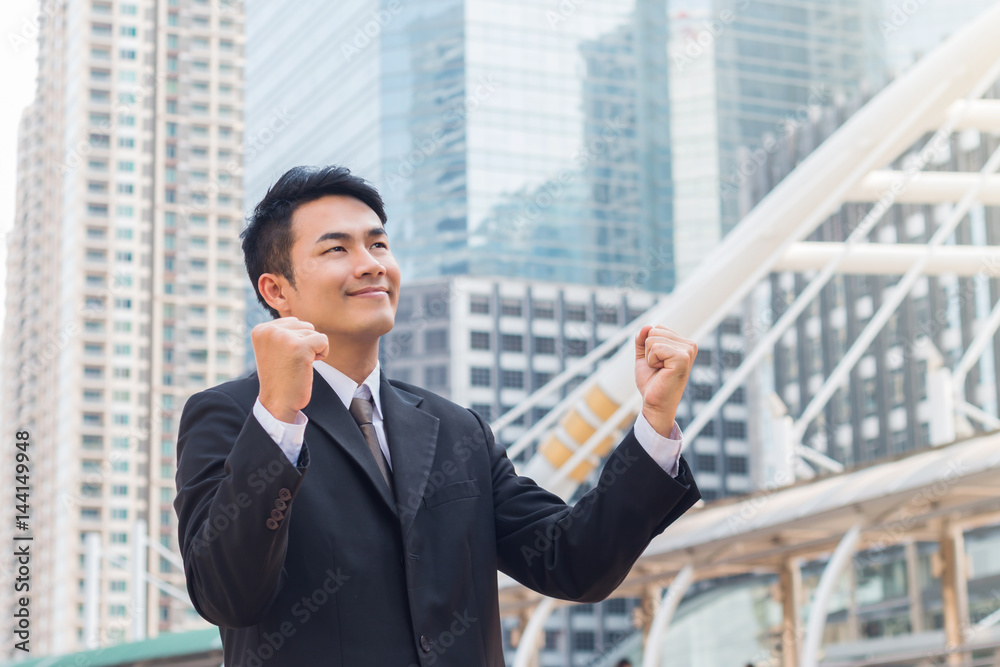 portrait of business man standing with commitment to success in downtown with building background portrait of business man standing with commitment to success in downtown with building background