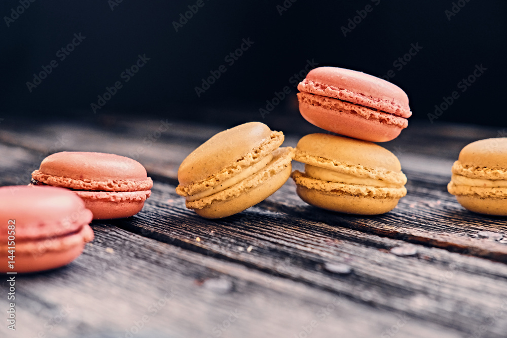 Delicious, colorful cookies on a grey wooden table. Delicious, colorful cookies on a grey wooden table.