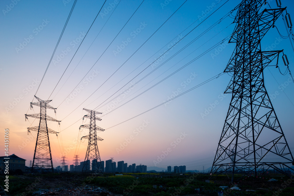 pylons in blue sky at sunrise