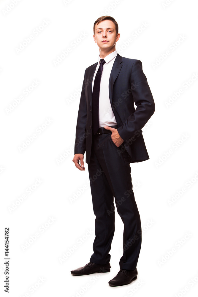 Stylish young man in suit and tie. Business style. Handsome man standing and looking at the camera Stylish young man in suit and tie. Business style. Handsome man standing and looking at the camera