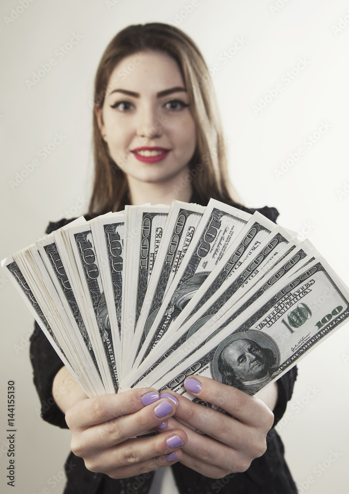 Woman holding money blur face view portrait Woman holding money blur face view portrait