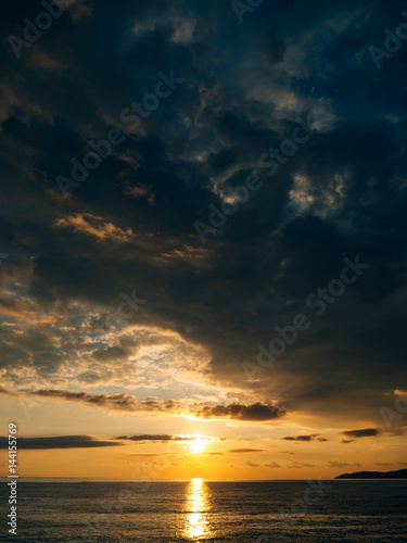 Sunset over the sea. Sunset over the Adriatic Sea. Sun to sit down in the water © Nadtochiy