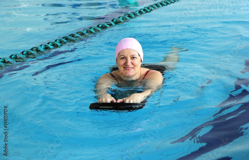 Middle Aged Woman in Swimming Pool