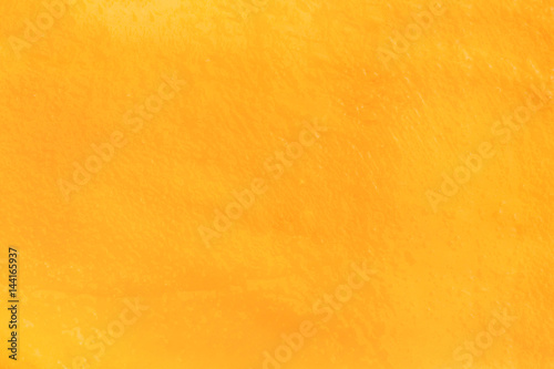 Macro fresh yellow ripe mango texture background with juice for graphic design or commercial use