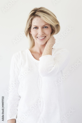 Smiling blue eyed blond woman, portrait