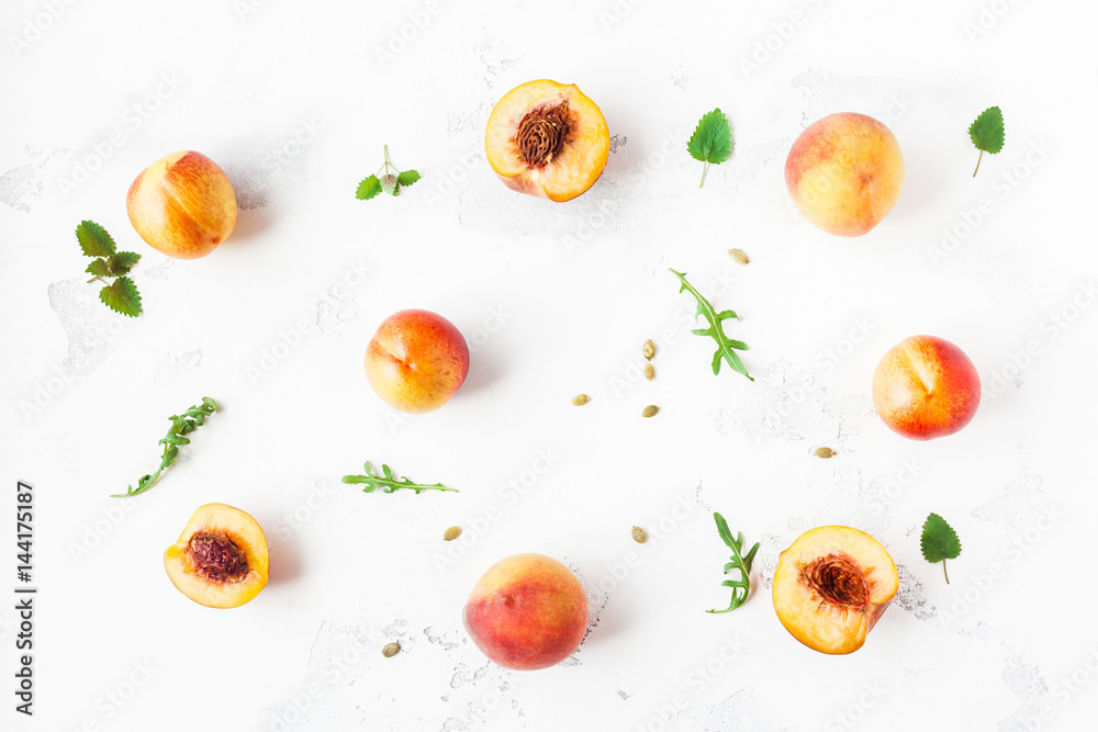 Fresh peaches. Sliced peaches on white background. Flat lay, top view Fresh peaches. Sliced peaches on white background. Flat lay, top view