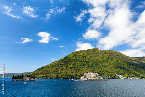 Blue sky over the Our Lady of the Rock and the Sveti Dordje churches on neighboring islands in the Bay of Kotor, Montenegro.