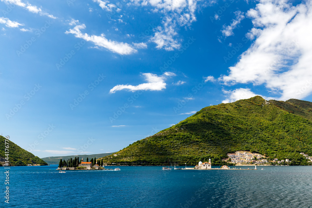 The Our Lady of the Rock and the Sveti Dordje churches on neighboring islands in the Bay of Kotor, Montenegro. The Our Lady of the Rock and the Sveti Dordje churches on neighboring islands in the Bay of Kotor, Montenegro.