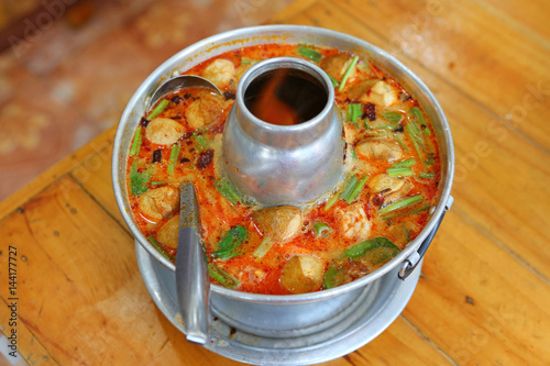 hot soup shrimp Thai food in fire pot photo