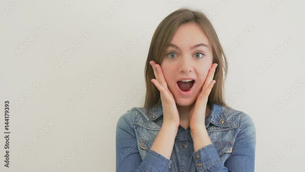 Smiling woman surprising with her mouth open Smiling woman surprising with her mouth open