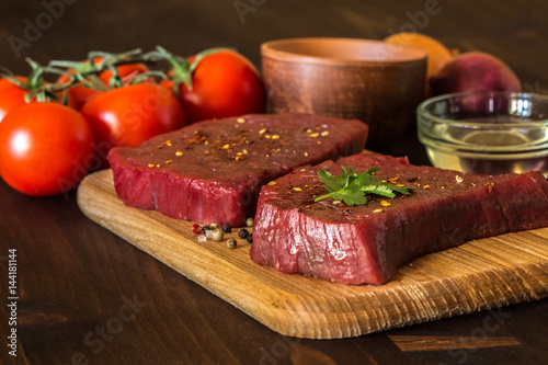 raw beef steak with ingredients for cooking