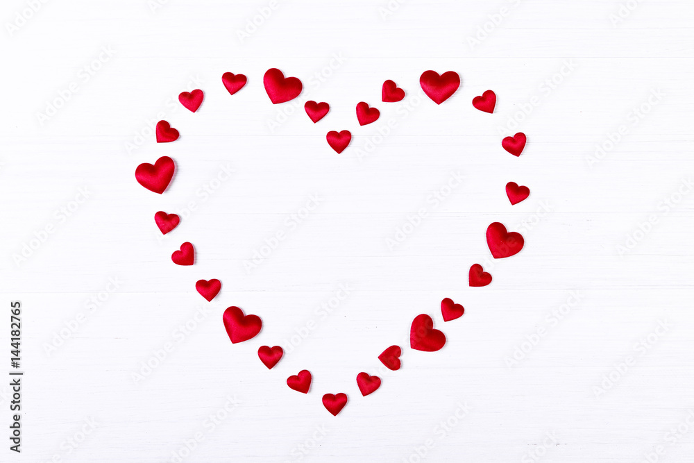 Red heart. Valentines day. Symbol of love. Romantic greeting background. On white wooden table.